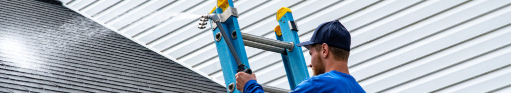 Perfect Power Wash technician shows how to safely remove algae from your roof by performing a roof treatment