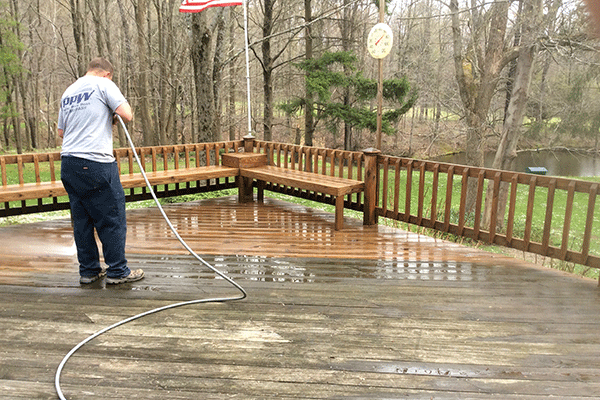 Perfect Power Wash technician power washing a deck